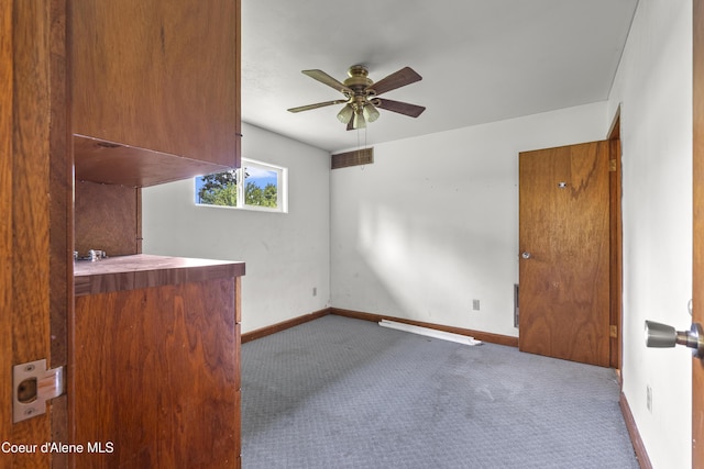 206 E 2nd Ave, Clark Fork, ID 83811 - unfurnished living room with carpet flooring, ceiling fan, and baseboards