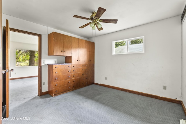 206 E 2nd Ave, Clark Fork, ID 83811 - unfurnished bedroom featuring light carpet, multiple windows, and baseboards