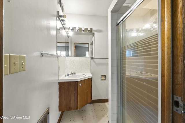 206 E 2nd Ave, Clark Fork, ID 83811 - full bath with vanity, a shower stall, and tasteful backsplash