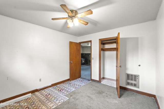 206 E 2nd Ave, Clark Fork, ID 83811 - unfurnished bedroom featuring carpet floors, baseboards, a closet, and heating unit