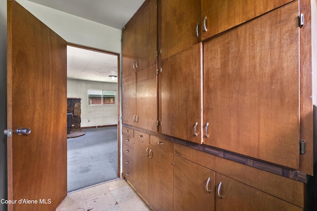 206 E 2nd Ave, Clark Fork, ID 83811 - detailed view of carpet floors and a wood stove