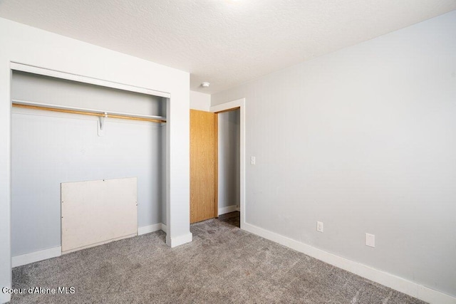 3551 N Carriage Ct, Post Falls, ID 83854 - unfurnished bedroom with carpet flooring, a closet, and a textured ceiling