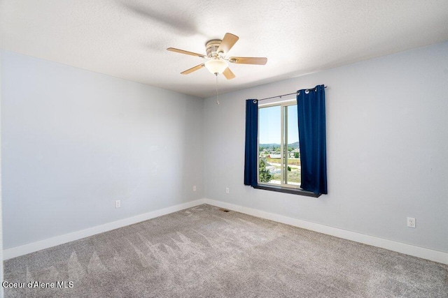 3551 N Carriage Ct, Post Falls, ID 83854 - carpeted spare room with a ceiling fan and a textured ceiling