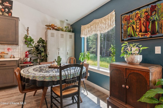 84 E Cabinet Wagon Rd, Clark Fork, ID 83811 - dining room with vaulted ceiling and light wood-style flooring