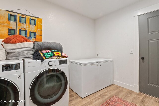 84 E Cabinet Wagon Rd, Clark Fork, ID 83811 - laundry area featuring washing machine and clothes dryer and light wood finished floors