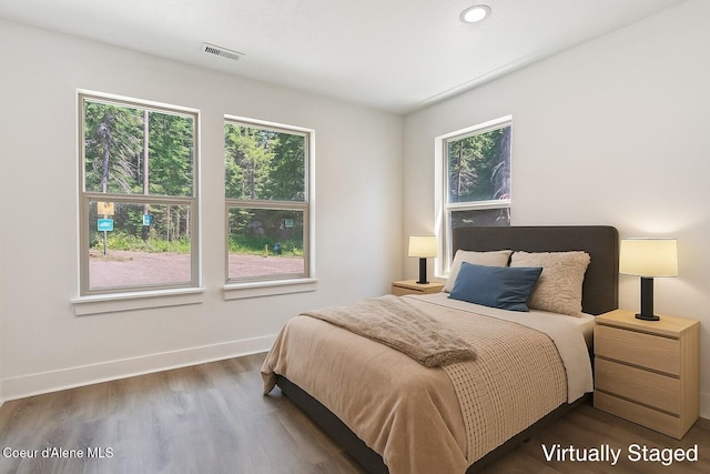84 E Cabinet Wagon Rd, Clark Fork, ID 83811 - bedroom featuring wood finished floors and baseboards