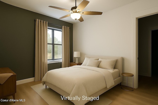84 E Cabinet Wagon Rd, Clark Fork, ID 83811 - bedroom with wood finished floors and ceiling fan