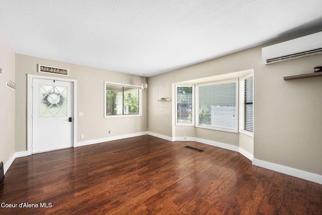 1215 N A St, Coeur Dalene, ID 83814 - entryway featuring a wall unit AC and wood finished floors