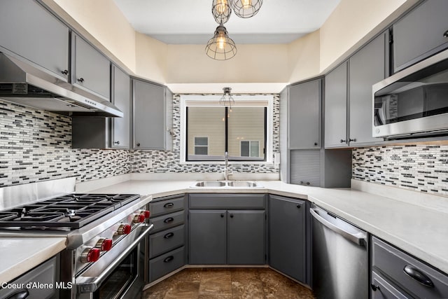 1215 N A St, Coeur Dalene, ID 83814 - kitchen featuring appliances with stainless steel finishes, under cabinet range hood, gray cabinets, decorative backsplash, and light countertops