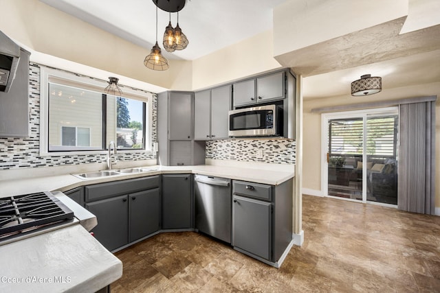 1215 N A St, Coeur Dalene, ID 83814 - kitchen with appliances with stainless steel finishes, gray cabinets, decorative backsplash, and hanging light fixtures