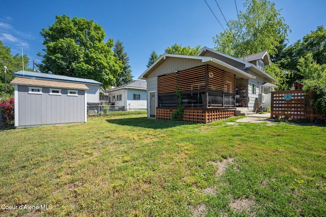 1215 N A St, Coeur Dalene, ID 83814 - back of property featuring a shed, board and batten siding, and a wooden deck