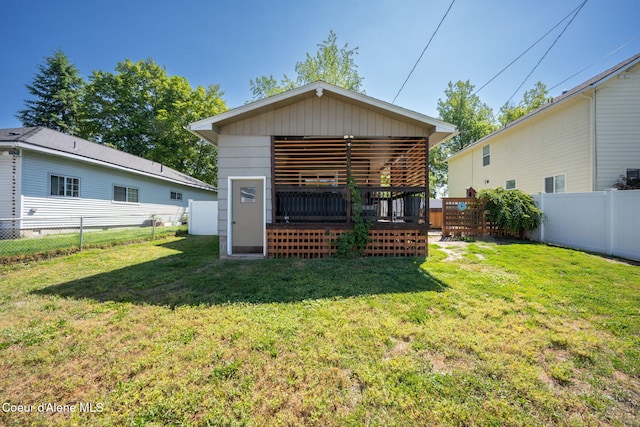 1215 N A St, Coeur Dalene, ID 83814 - rear view of house featuring a fenced backyard and a wooden deck