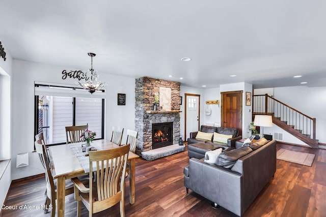115 W Lakeview Blvd, Priest River, ID 83856 - living room featuring stairway, a chandelier, a fireplace, wood finished floors, and recessed lighting