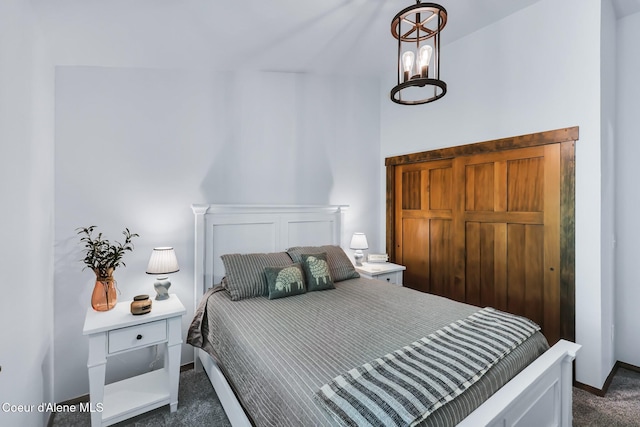 115 W Lakeview Blvd, Priest River, ID 83856 - bedroom with dark colored carpet and a chandelier