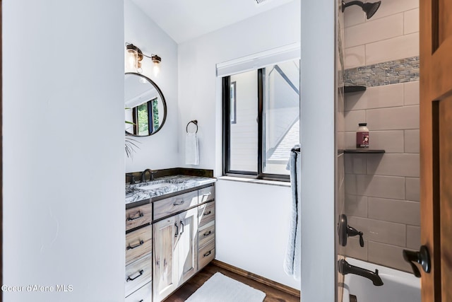 115 W Lakeview Blvd, Priest River, ID 83856 - full bathroom with vanity, wood finished floors, and washtub / shower combination