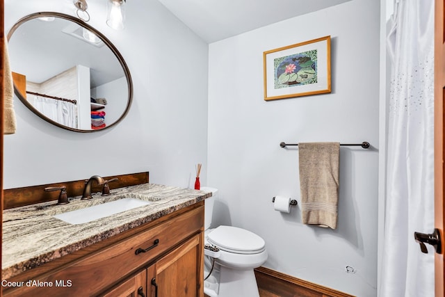 115 W Lakeview Blvd, Priest River, ID 83856 - full bath with vanity, wood finished floors, and a shower with curtain