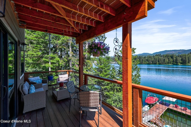 115 W Lakeview Blvd, Priest River, ID 83856 - wooden terrace featuring a water and mountain view, a view of trees, and an outdoor living space
