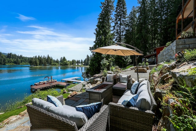 115 W Lakeview Blvd, Priest River, ID 83856 - view of patio / terrace featuring an outdoor living space with a fire pit, a water view, a floating dock, and a view of trees