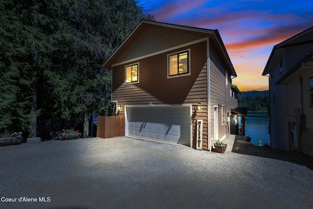 115 W Lakeview Blvd, Priest River, ID 83856 - view of front of home featuring a garage and gravel driveway