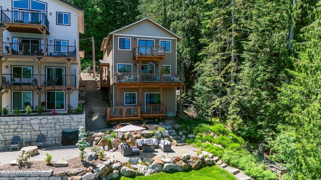 115 W Lakeview Blvd, Priest River, ID 83856 - rear view of property with a balcony, outdoor lounge area, and a patio