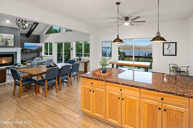 3889 E Avery Ln, Coeur Dalene, ID 83814 - kitchen featuring ceiling fan, light wood-type flooring, healthy amount of natural light, a lit fireplace, and recessed lighting
