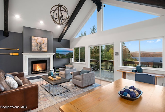 3889 E Avery Ln, Coeur Dalene, ID 83814 - living room with beamed ceiling, wood finished floors, a chandelier, a tile fireplace, and high vaulted ceiling
