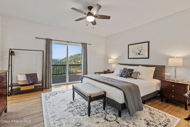 3889 E Avery Ln, Coeur Dalene, ID 83814 - bedroom with access to outside, light wood-type flooring, and a ceiling fan