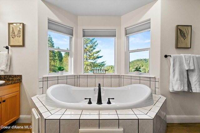 3889 E Avery Ln, Coeur Dalene, ID 83814 - full bath with vanity, healthy amount of natural light, and a garden tub