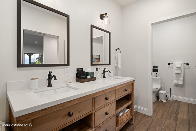 3889 E Avery Ln, Coeur Dalene, ID 83814 - full bathroom featuring wood finished floors and double vanity
