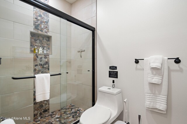 3889 E Avery Ln, Coeur Dalene, ID 83814 - bathroom with toilet and a shower stall