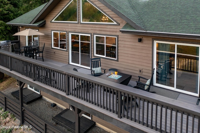 3889 E Avery Ln, Coeur Dalene, ID 83814 - wooden deck featuring outdoor dining space, a fire pit, and a grill