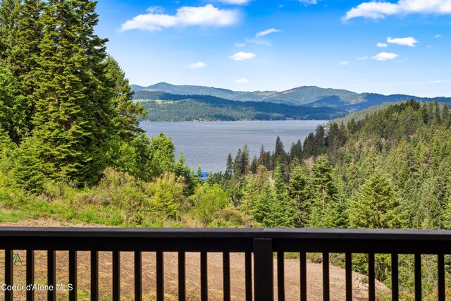 3889 E Avery Ln, Coeur Dalene, ID 83814 - view of mountain backdrop featuring a large body of water and a forest