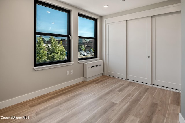 503 Cedar St # 203, Sandpoint, ID 83864 - unfurnished bedroom with a closet and light wood-style flooring