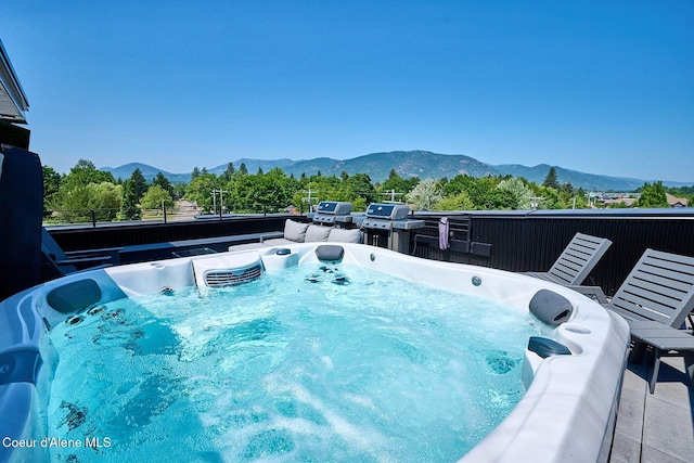 503 Cedar St # 203, Sandpoint, ID 83864 - view of pool featuring a hot tub and a mountain view