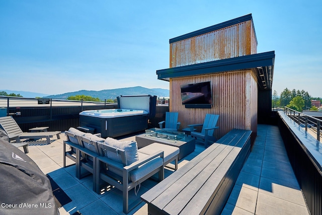 503 Cedar St # 203, Sandpoint, ID 83864 - wooden deck featuring a hot tub, a patio, and an outdoor fire pit