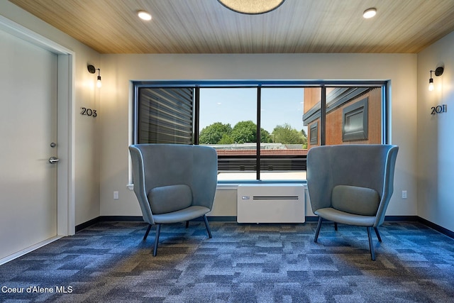 503 Cedar St # 203, Sandpoint, ID 83864 - sitting room featuring dark carpet, wooden ceiling, and recessed lighting