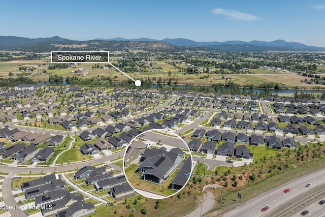 22830 E Bailey Ct, Liberty Lake, WA 99019 - aerial overview of property's location featuring a water and mountain view and nearby suburban area