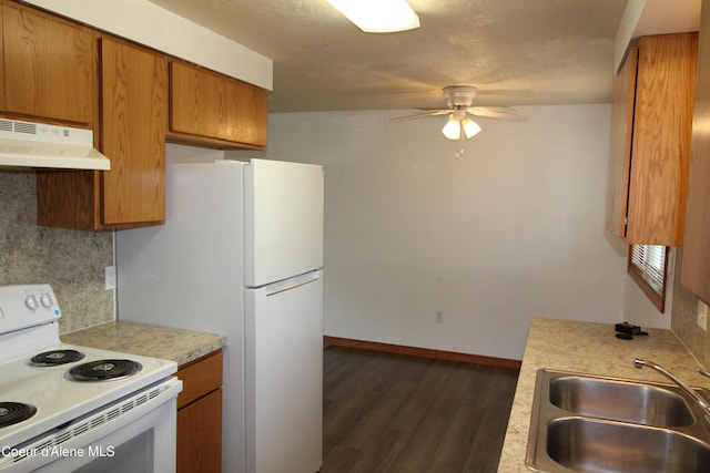 807809 E Timber Ln, Coeur Dalene, ID 83814 - kitchen featuring under cabinet range hood, white appliances, a ceiling fan, brown cabinetry, and light countertops