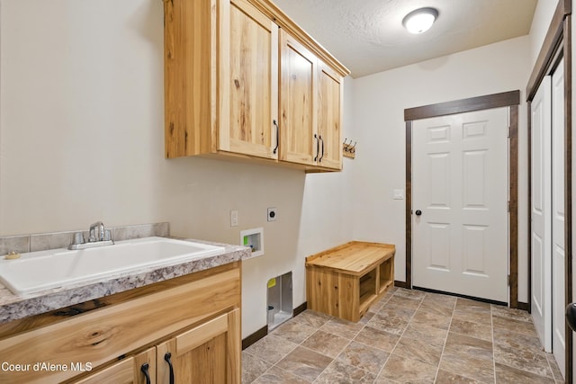 6984 W Blacktail Ave, Rathdrum, ID 83858 - laundry room with hookup for an electric dryer, cabinet space, washer hookup, and light stone finish floors