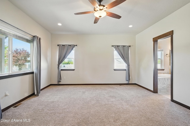 6984 W Blacktail Ave, Rathdrum, ID 83858 - empty room with healthy amount of natural light, light colored carpet, a ceiling fan, and recessed lighting