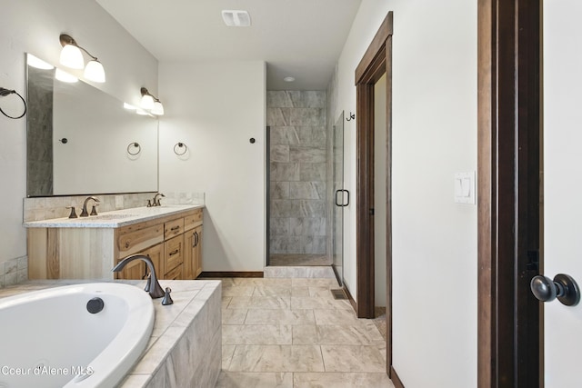 6984 W Blacktail Ave, Rathdrum, ID 83858 - full bath with double vanity, a shower stall, a bath, and marble finish floors