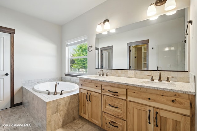 6984 W Blacktail Ave, Rathdrum, ID 83858 - full bath featuring double vanity, a bath, and tile patterned flooring