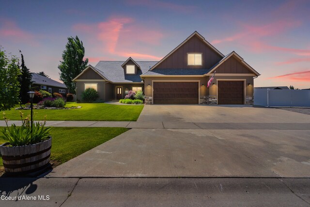 6984 W Blacktail Ave, Rathdrum, ID 83858 - craftsman house with board and batten siding, stone siding, driveway, and an attached garage