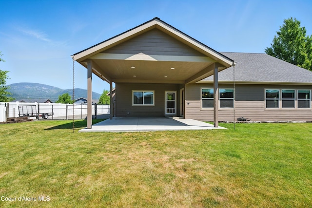 6984 W Blacktail Ave, Rathdrum, ID 83858 - rear view of house with a patio area and a mountain view
