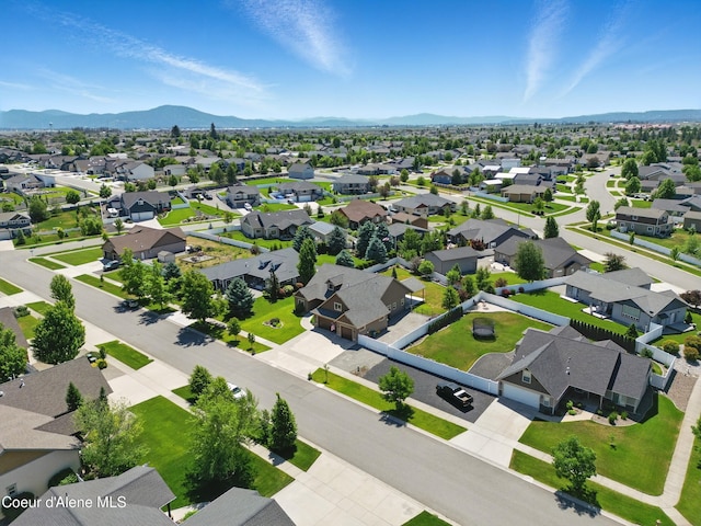 6984 W Blacktail Ave, Rathdrum, ID 83858 - aerial perspective of suburban area featuring a mountainous background