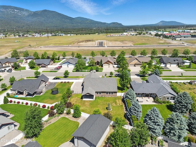 6984 W Blacktail Ave, Rathdrum, ID 83858 - aerial view of residential area with mountains