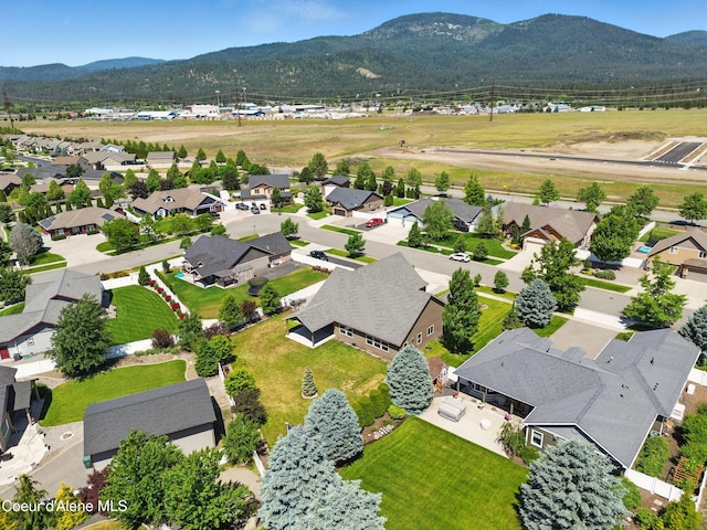 6984 W Blacktail Ave, Rathdrum, ID 83858 - aerial view of residential area featuring a mountain backdrop