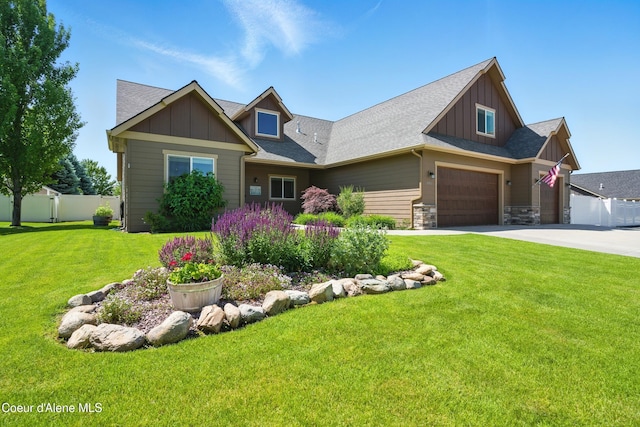 6984 W Blacktail Ave, Rathdrum, ID 83858 - craftsman-style home featuring board and batten siding, concrete driveway, and roof with shingles