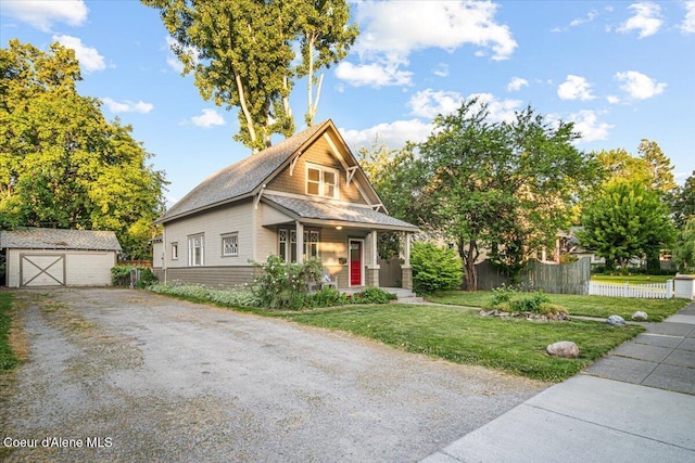 928 N 7th St, Coeur Dalene, ID 83814 - view of front facade with an outbuilding, a garage, and covered porch