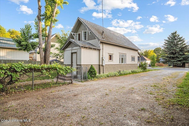 928 N 7th St, Coeur Dalene, ID 83814 - view of property exterior featuring driveway and a shingled roof